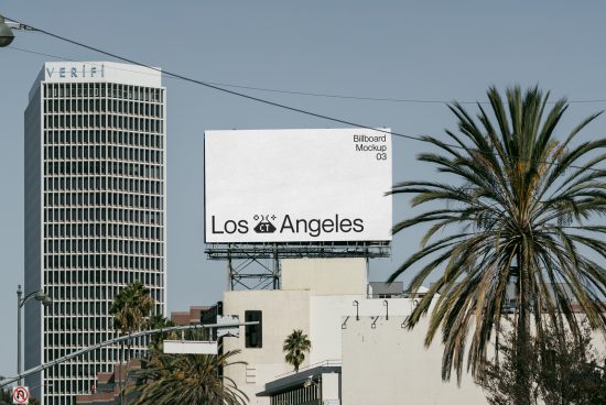 Urban billboard mockup on a clear day with Los Angeles text, ideal for advertising designs, placed near palm trees and modern building.
